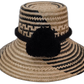 Elsie handmade Wayuu straw hat with bold black and natural palm weave and black pompom

