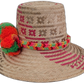 Artisan Wayuu hat Florence with natural straw, pink accents, and bright pompoms

