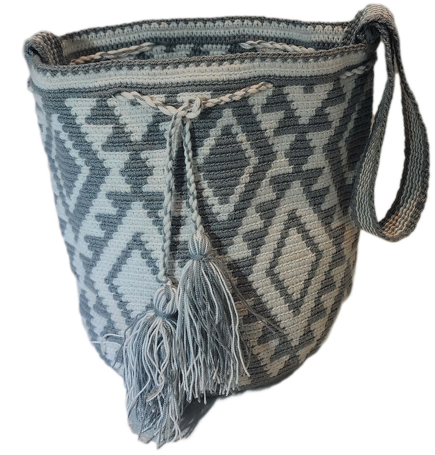 Gray and cream boho chick crochet bag with tribal Wayuu pattern and tassel drawstring, ideal as a shoulder or crossbody accessory.