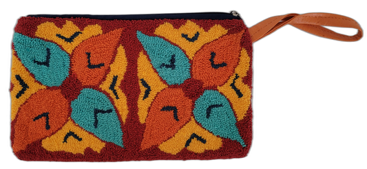 Boho chick punch needle clutch with vibrant embroidery and orange wrist strap

