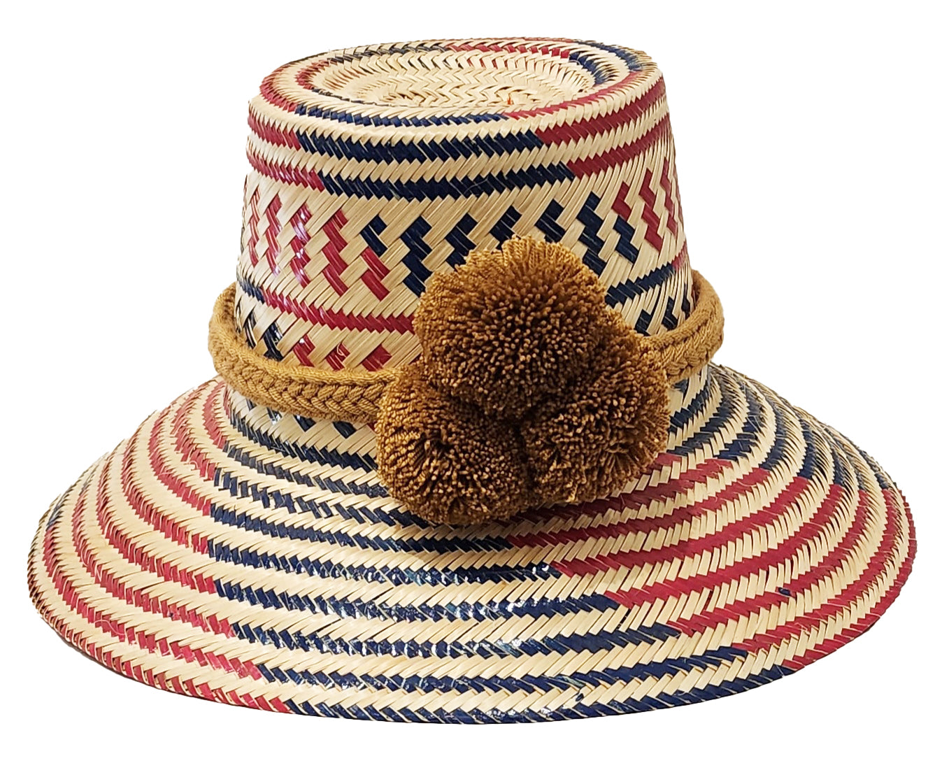 "Handcrafted colorful straw hat by Wayuu artisans using Iraca palm fibers, with adjustable weave and cultural pompoms."