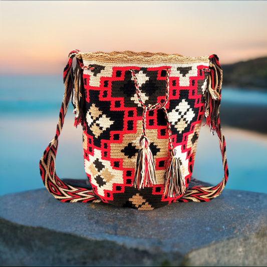 "Handcrafted crochet bags by Wayuu women, vibrant with cultural symbols and colors, supporting sustainable community growth."