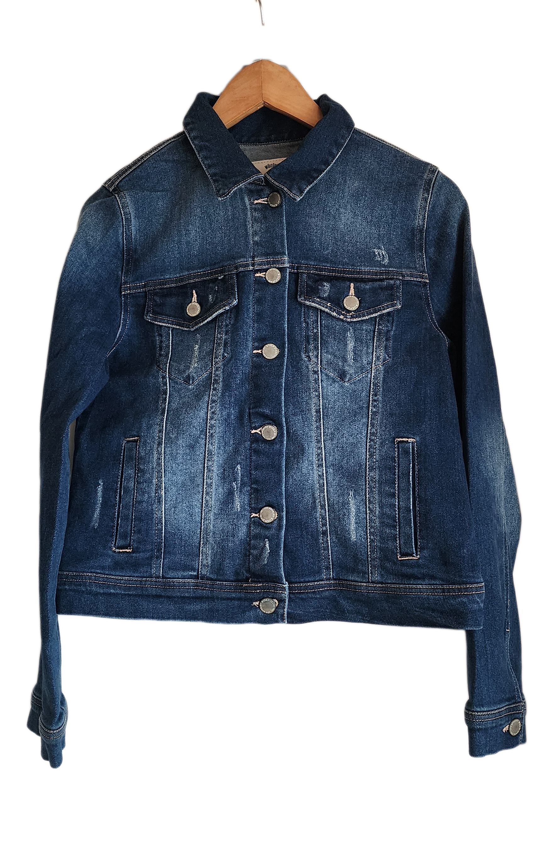 "Handcrafted denim jacket with colorful punch needle embroidery on the back, showcasing unique Wayuu-inspired patterns and fa