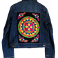 "Handcrafted denim jacket with vibrant, Wayuu-inspired punch needle embroidery on the back, showcasing artisanal craftsmanshi