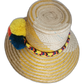 Boho chick Wayuu hat in sunny yellow weave with bold, handmade pompoms in summer tones.