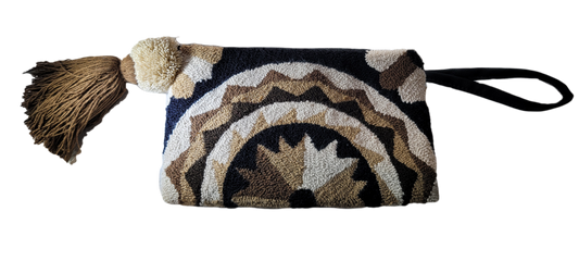 "Handcrafted Wuitusu Wayuu Needle Punch Clutch with colorful, unique patterns and zippered closure, supporting fair trade pra
