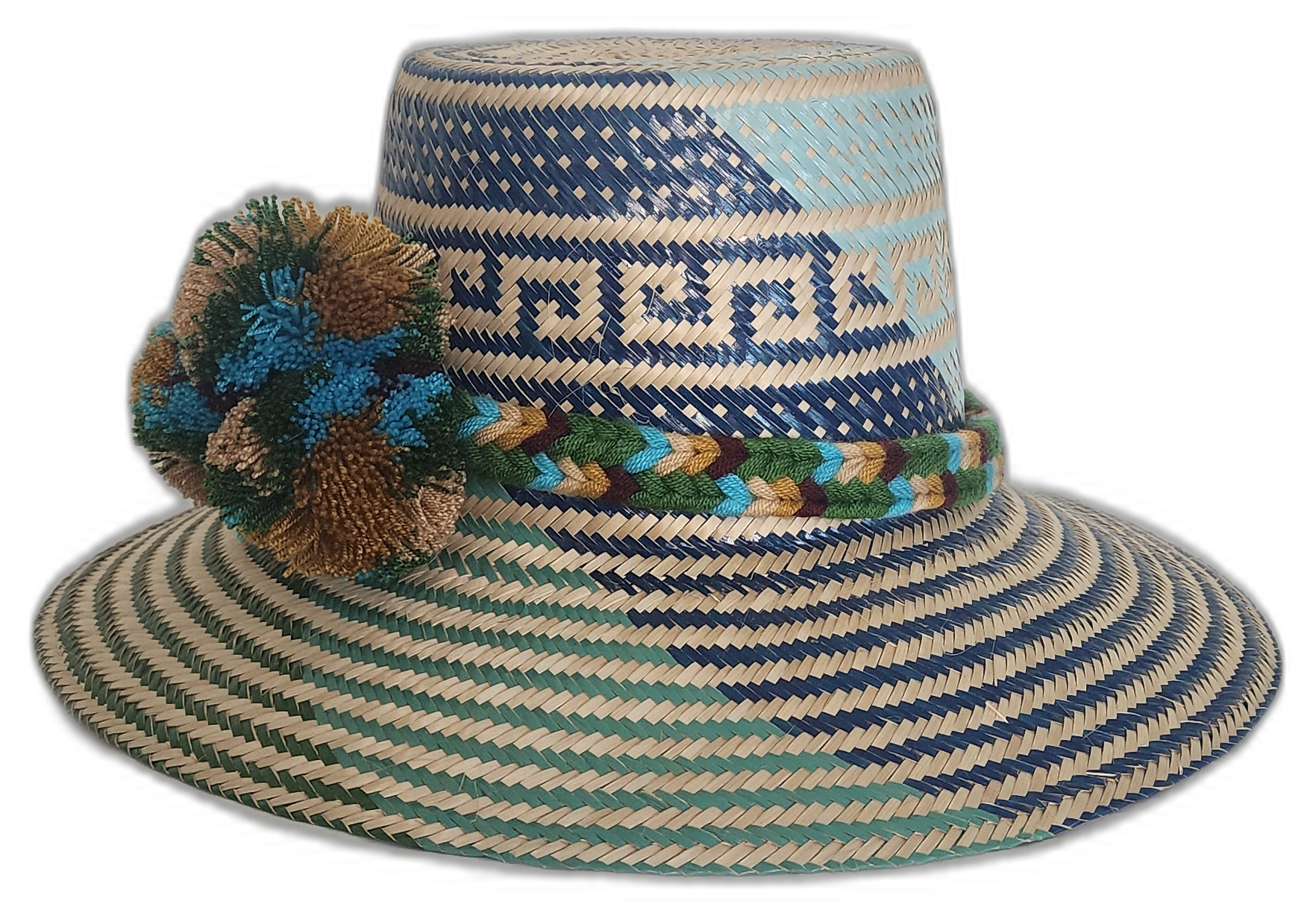Colorful Wayuu hat in green and blue tones with woven crown and soft pompom details