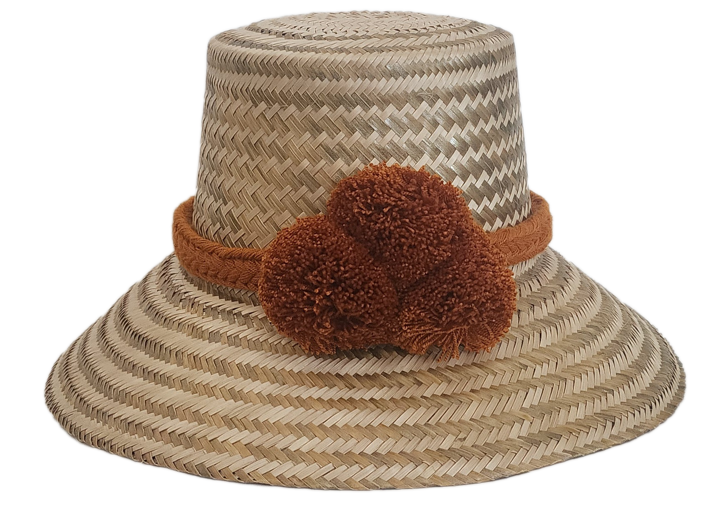 Wayuu handmade straw hat with solid brown braided band and pom-poms — a chic, boho-inspired summer accessory.
