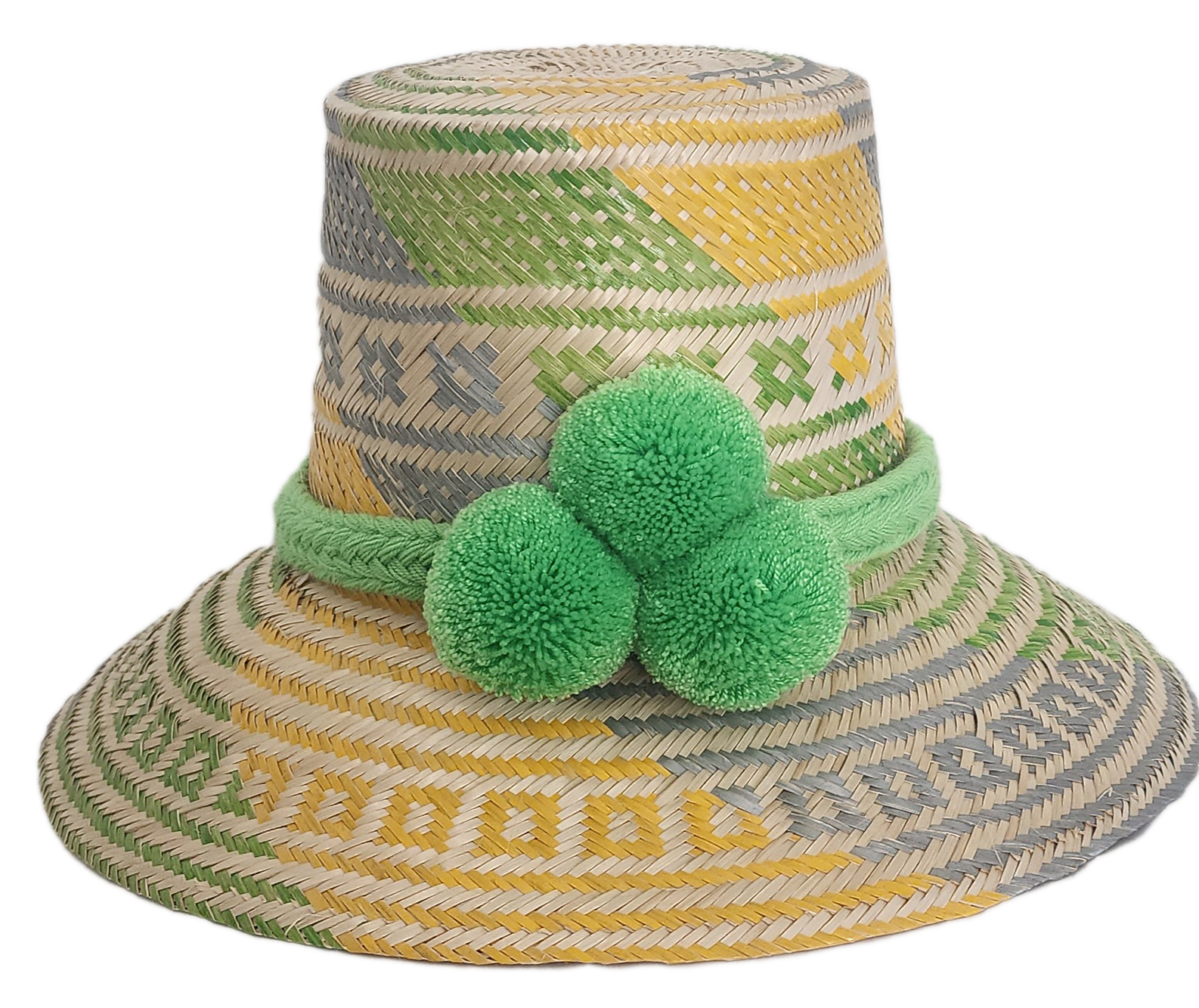 Handwoven Wayuu straw hat with green, yellow, and gray tribal patterns, wide brim, and bright green pom-pom band. A bold, bohemian summer accessory.