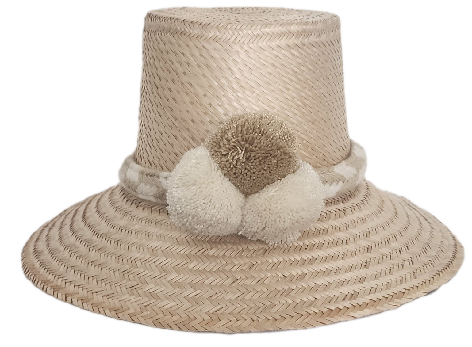 Handwoven Wayuu straw hat in soft beige tones, featuring a wide brim and braided band adorned with neutral cream and taupe pom-poms. Elegant boho style.