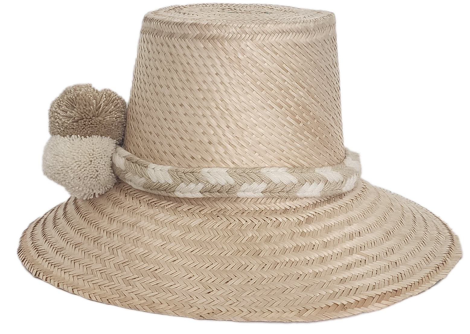 Handwoven Wayuu straw hat in soft beige tones, featuring a wide brim and braided band adorned with neutral cream and taupe pom-poms. Elegant boho style.