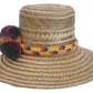 Bohemian Wayuu hat handmade with straw and adorned with colorful yarn pom-poms and a braided band.