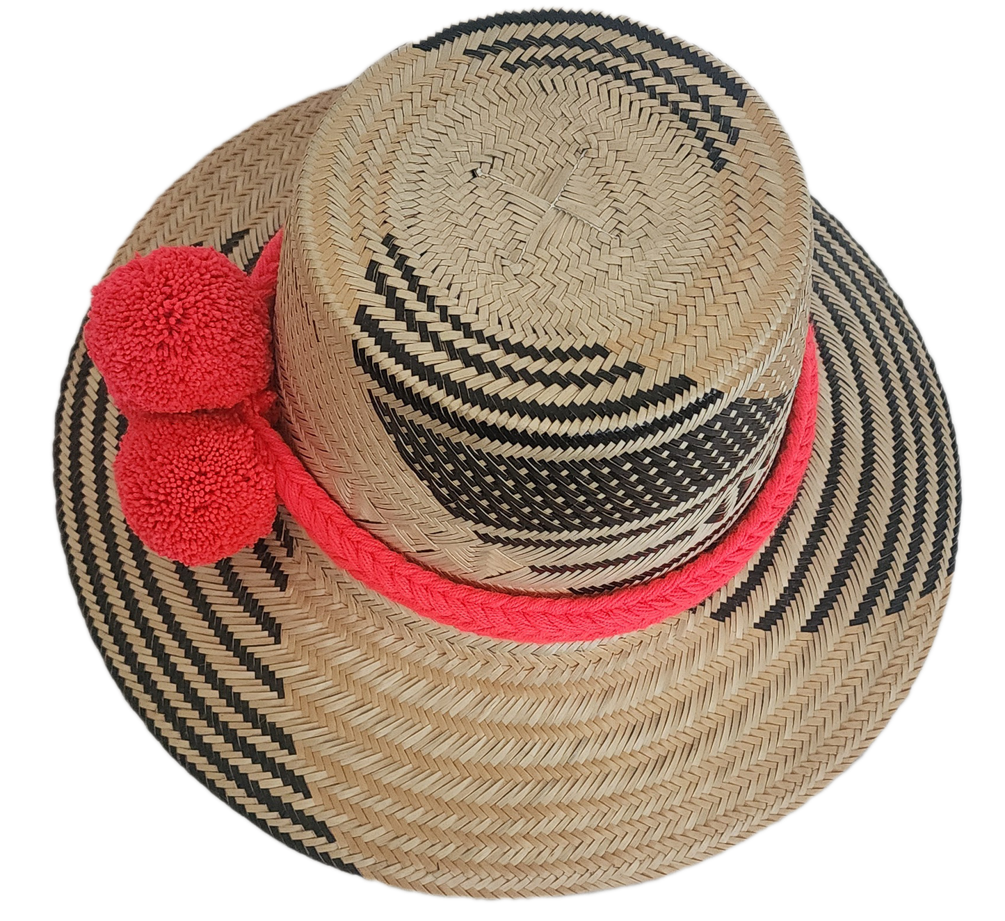 Bohemian straw hat with red yarn pom-poms and black tribal weave — handmade by Wayuu artisans.