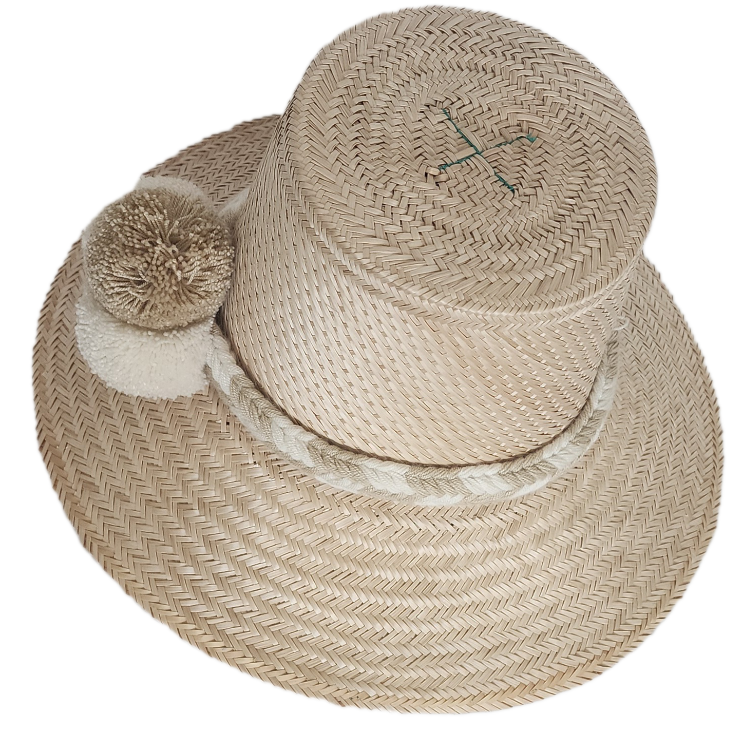 Handwoven Wayuu straw hat in soft beige tones, featuring a wide brim and braided band adorned with neutral cream and taupe pom-poms. Elegant boho style.