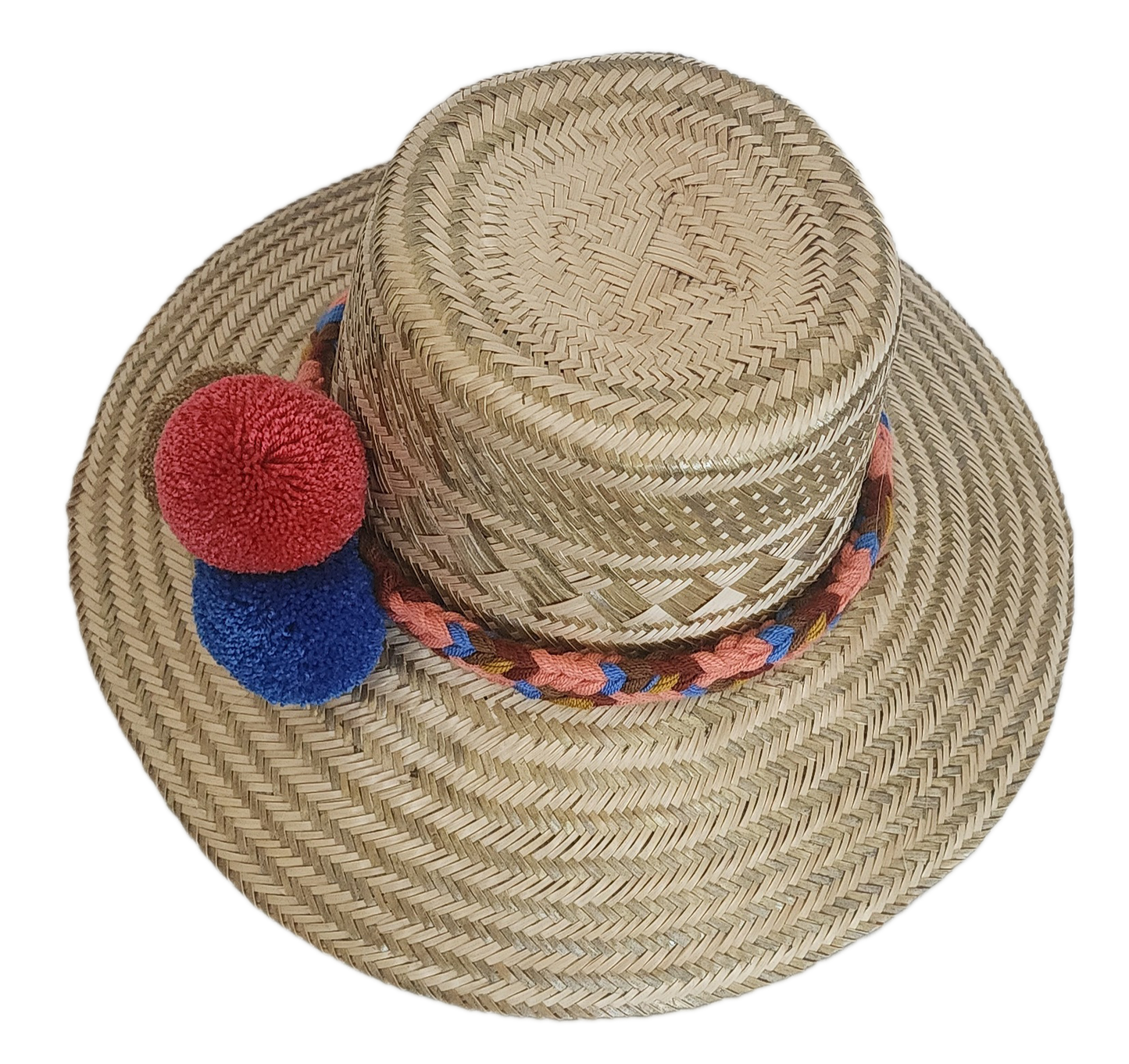 Artisan-crafted Wayuu straw hat with colorful handwoven band and decorative pom-poms — bohemian and eco-friendly.