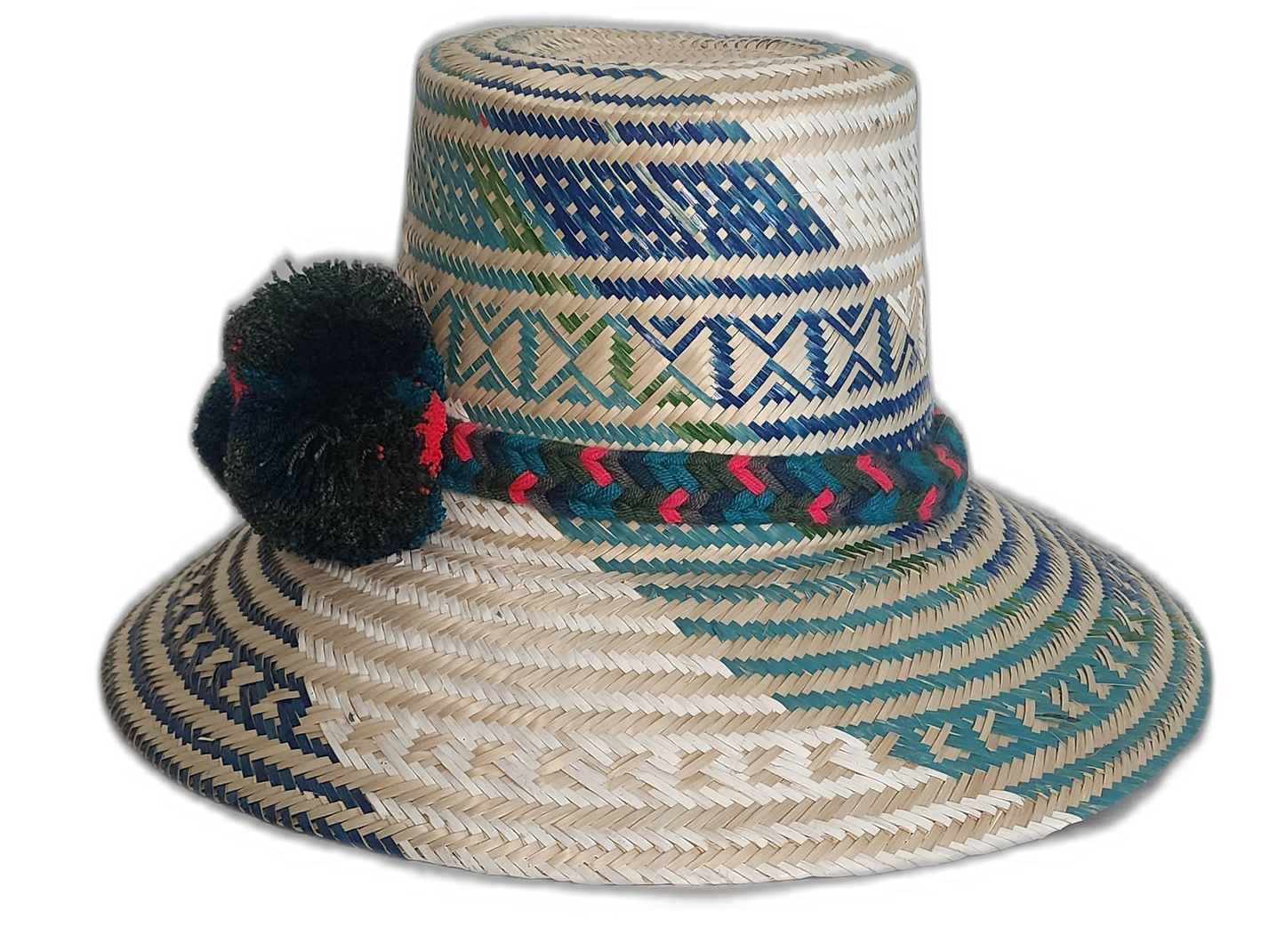 Colorful Wayuu hat with forest-toned straw weaving and vibrant handmade pompoms.