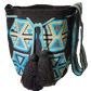 Boho chick Wayuu bag in black with geometric motifs and black tassels.