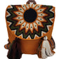 Boho chick Wayuu crochet backpack with tassels and bold circular design.