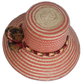 Handmade straw hat in bold pink and cream zigzag pattern with Boho chic styling details.
