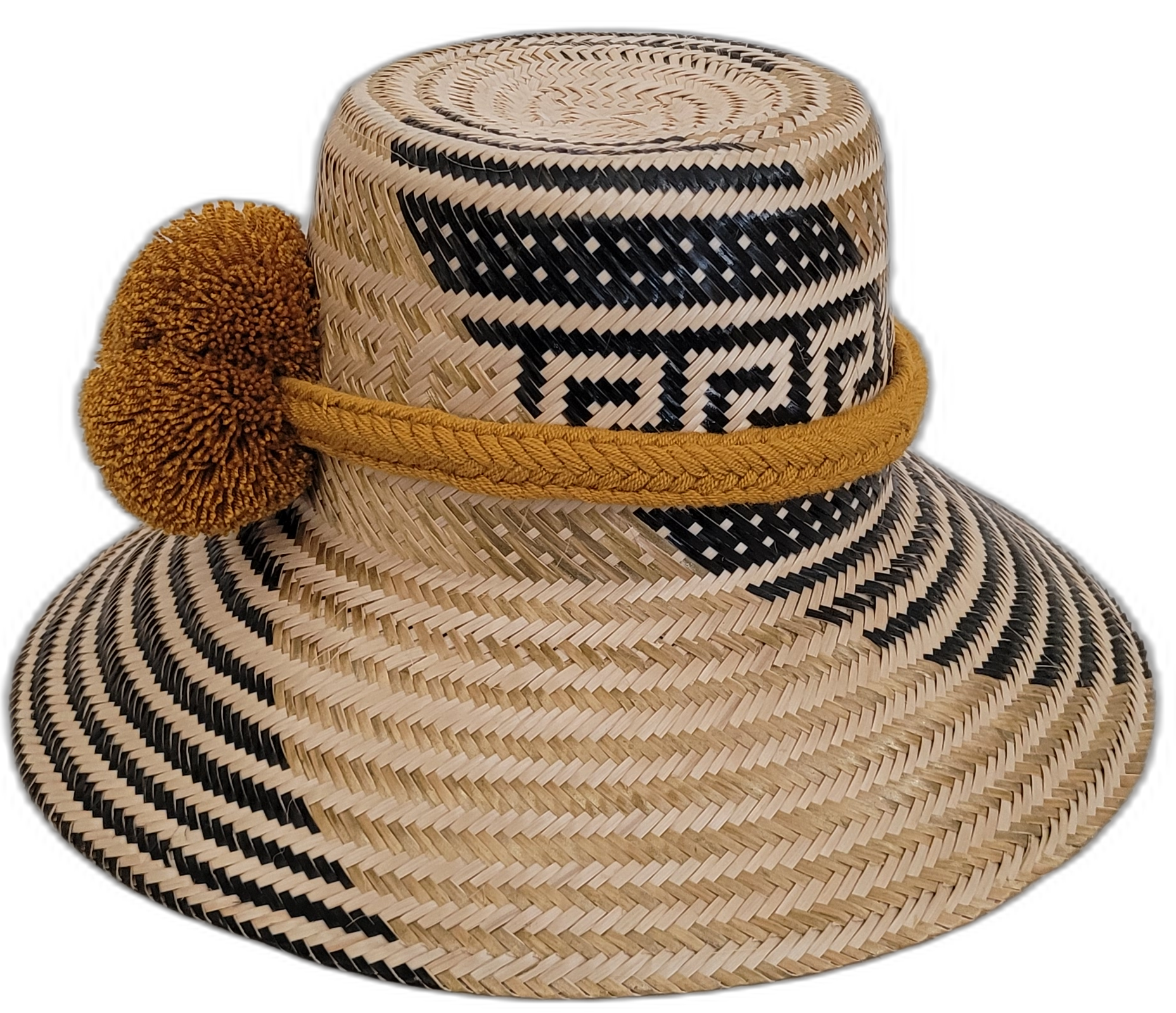 Unique Wayuu artisan straw hat, featuring bold black weave and golden mustard pompom accents.

