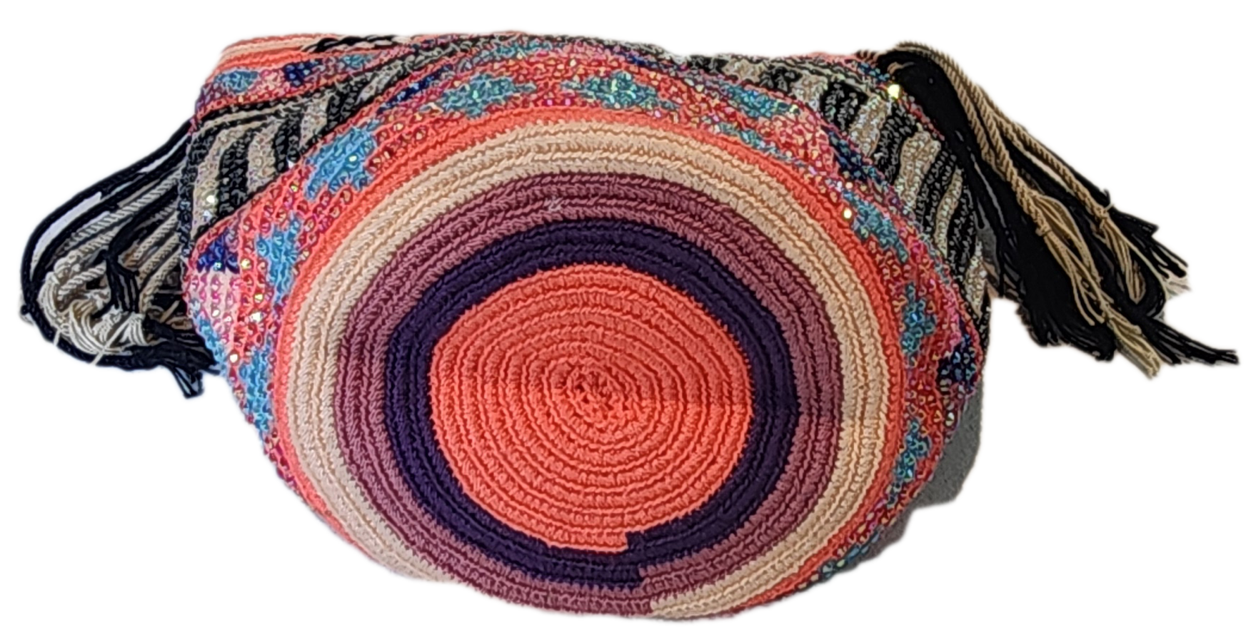 "Handmade colorful Wayuu crochet bag with intricate patterns and adjustable straps, showcasing sustainable and ethical fashio