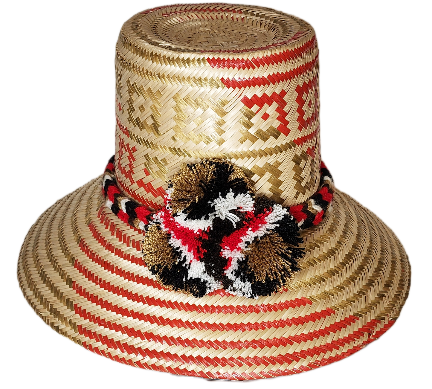 "Handmade colorful Wayuu hat from Colombia and Venezuela, crafted from Iraca palm fibers, decorated with symbolic pompoms."