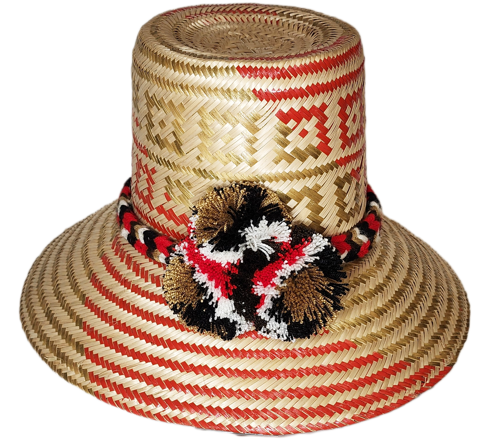 "Handmade colorful Wayuu hat from Colombia and Venezuela, crafted from Iraca palm fibers, decorated with symbolic pompoms."