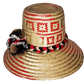 "Handmade colorful Wayuu hat from Colombia and Venezuela, crafted from Iraca palm fibers, decorated with symbolic pompoms."