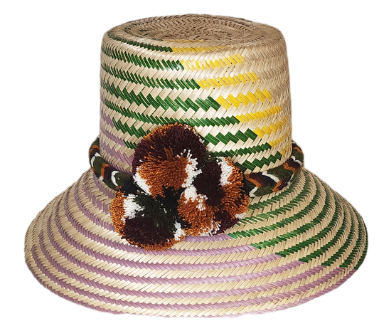 "Handmade colorful Wayuu hat from Wuitusu, adorned with vibrant pompoms, woven from Iraca palm fibers, symbolizing prosperity