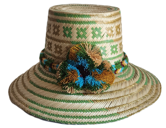 "Handmade colorful Wayuu hat woven from Iraca palm, adorned with culturally significant pompoms, adjustable fit."