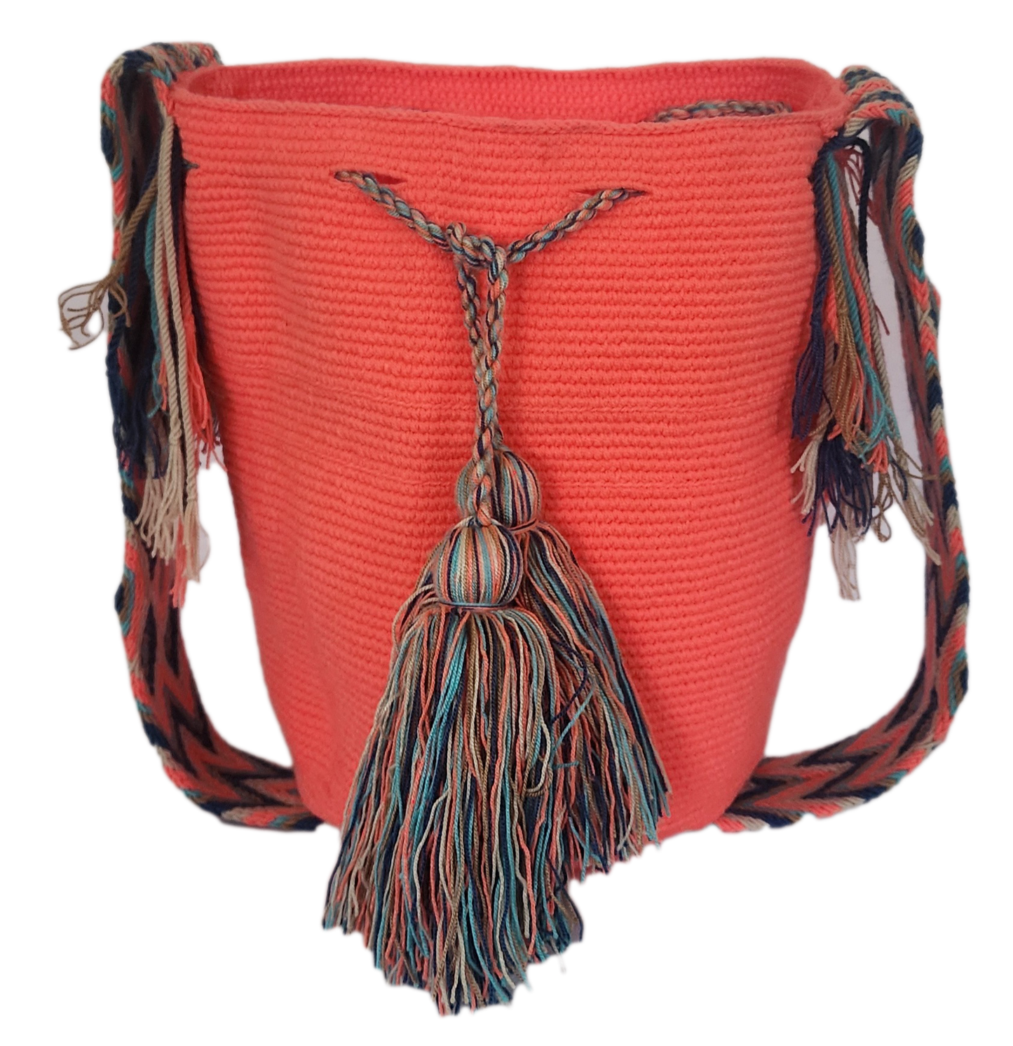 Handmade Wayuu mochila in coral pink with colorful tassel accents and braided shoulder strap — a vibrant, bohemian crochet bag.