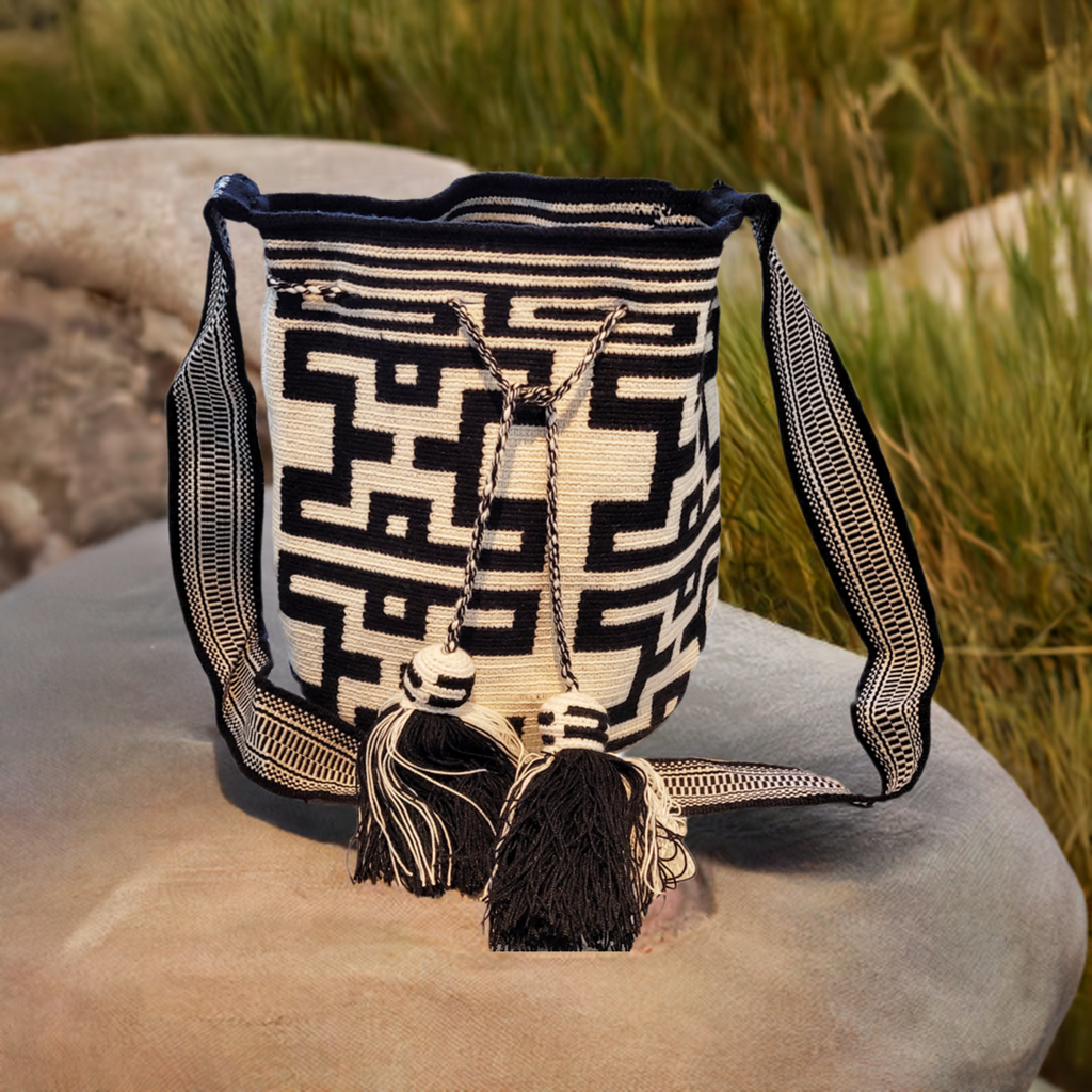 "Handmade Paleteada Crochet Wayuu Bag, colorful and bohemian, crafted by Wayuu artisans, supporting sustainable livelihoods."