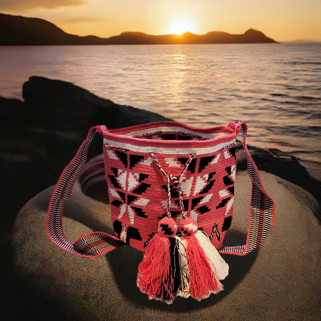 "Handmade Paleteada Crochet Wayuu Bag with colorful geometric patterns, crafted by the Wayuu tribes, featuring a versatile st