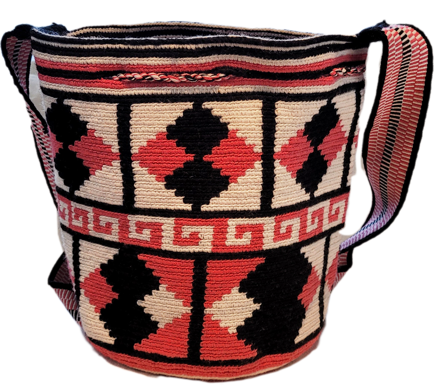 "Handmade Paleteada Wayuu crochet bag, colorful and bohemian, crafted by Colombian and Venezuelan artisans."