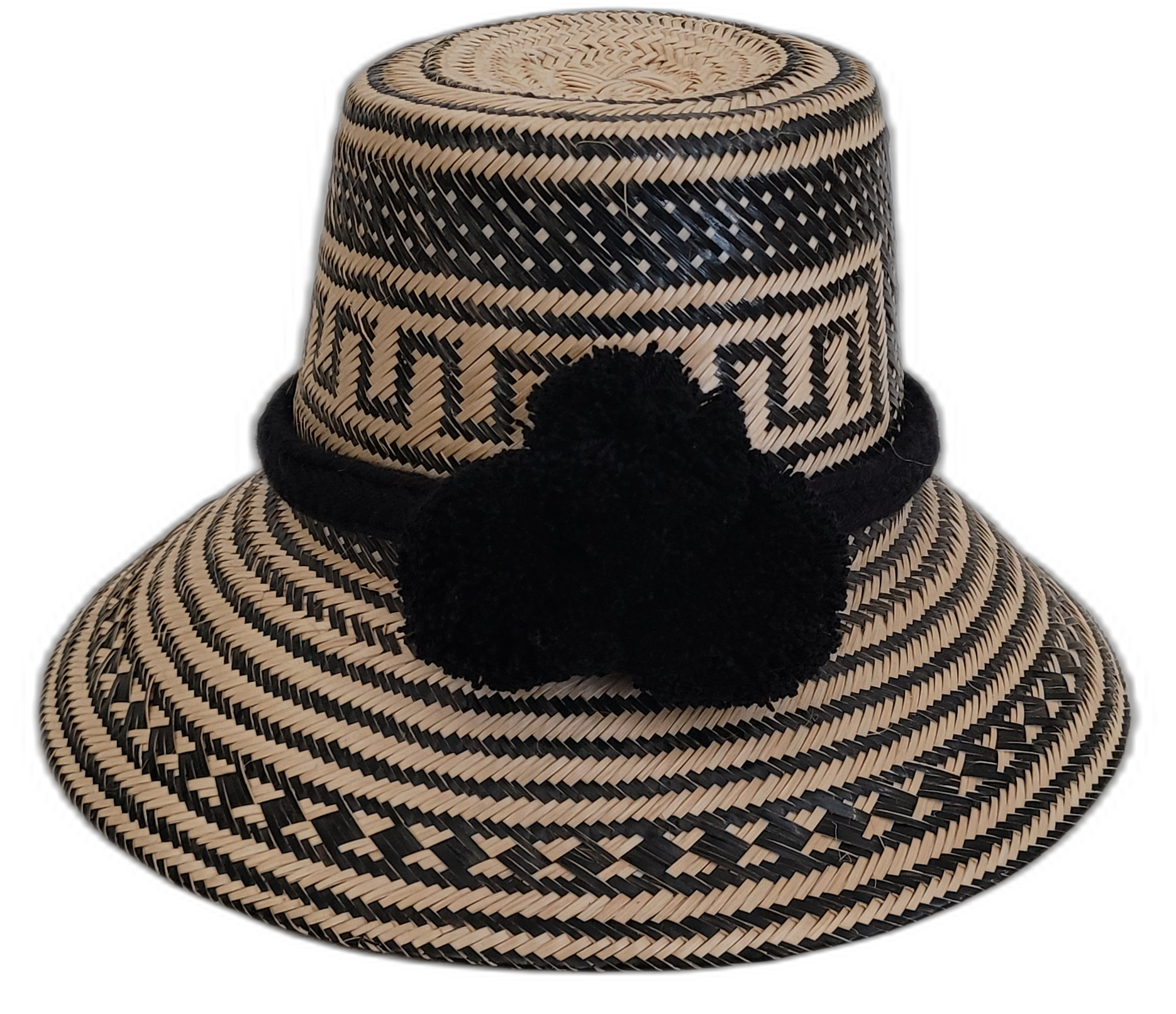Handmade black Wayuu straw hat with matching black pompoms, artisan woven.


