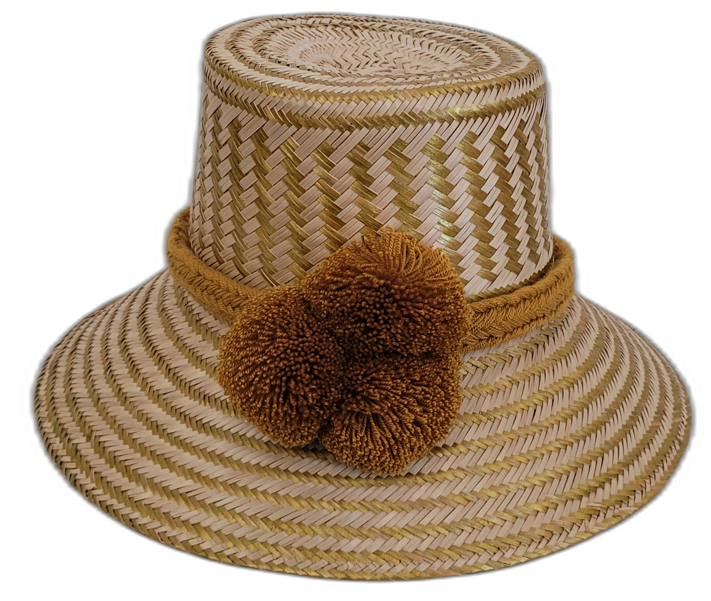 Handmade Wayuu boho straw hat with golden-brown pompoms and artisan weave.

