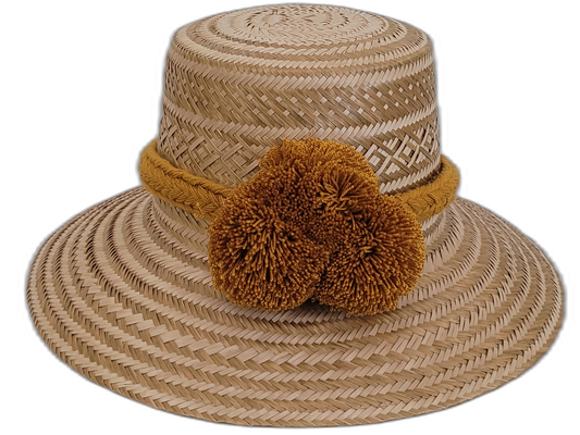 Handmade Wayuu boho straw hat with golden pompoms and natural woven pattern.

