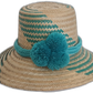 Handmade Wayuu straw hat with green chevron weave and large turquoise pompoms.Boho hat with bright blue pompoms and handwoven artisan design

