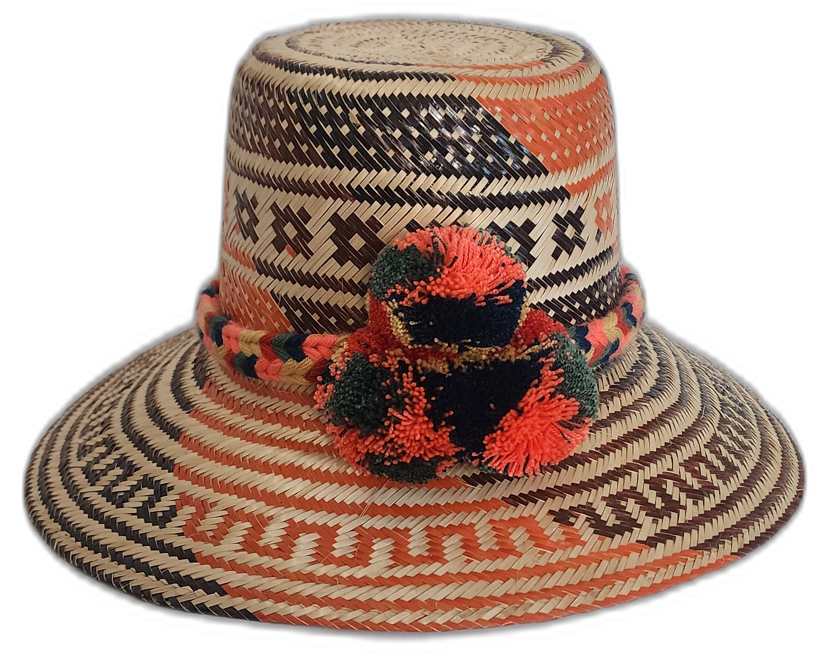 Handmade Wayuu straw hat with red, black, and green pompoms and tribal weave.