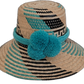 Handmade Wayuu boho straw hat with bright turquoise pompoms and artisan weave.

