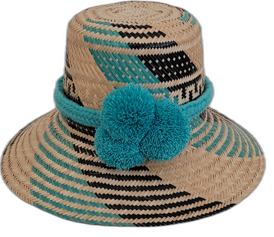 Handmade Wayuu boho straw hat with bright turquoise pompoms and artisan weave.

