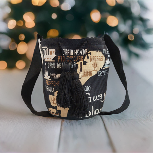 Handmade Wayuu crochet bag with a map of Guajira Peninsula in black and beige tones.