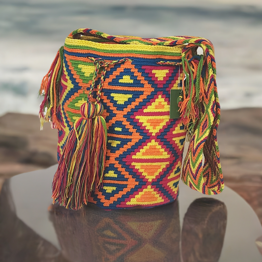 "Handmade Wayuu crochet bag from Colombia, vibrant with cultural patterns and colors, supporting fair trade and Wayuu heritag