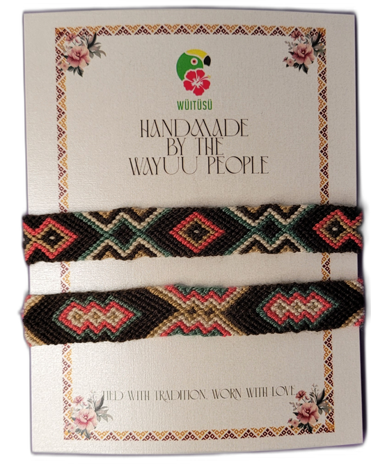 Handmade Wayuu friendship bracelets in black, coral, green, and cream with tribal geometric patterns