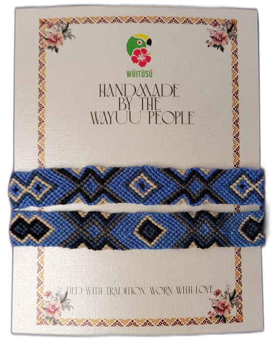 Artisan Wayuu bracelets in blue, black, gray, and cream with bold tribal patterns and motifs