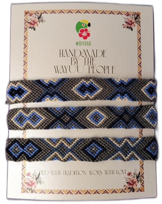 Handmade Wayuu friendship bracelets in blue, gray, and black with tribal geometric patterns
