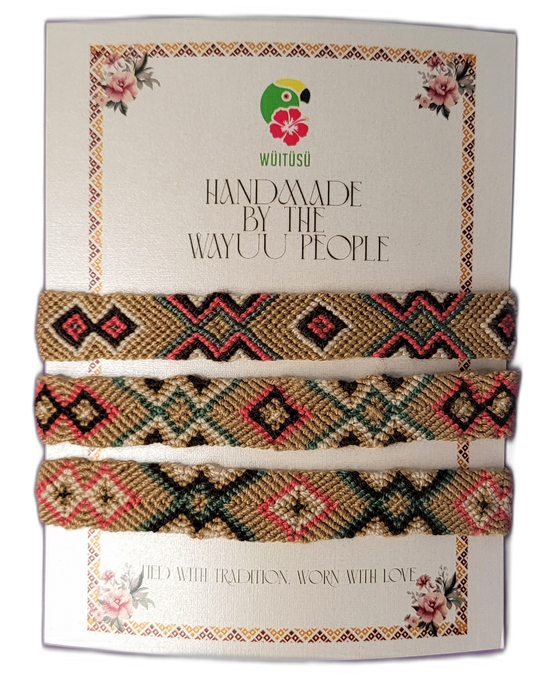 Handmade Wayuu friendship bracelets in tan, coral, black, and green with tribal geometric patterns

