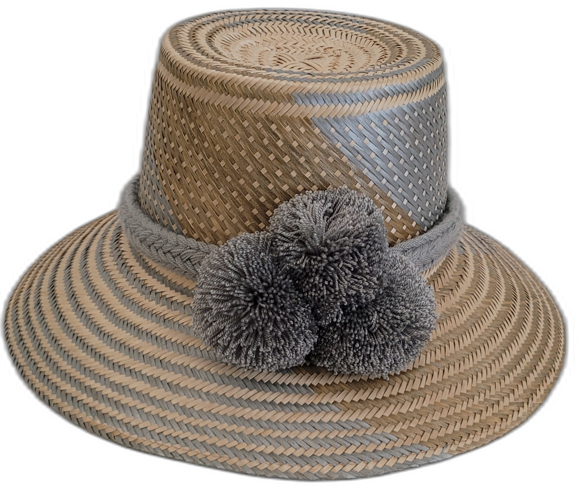 Handmade Wayuu straw hat with soft gray accents and matching gray pompoms.

