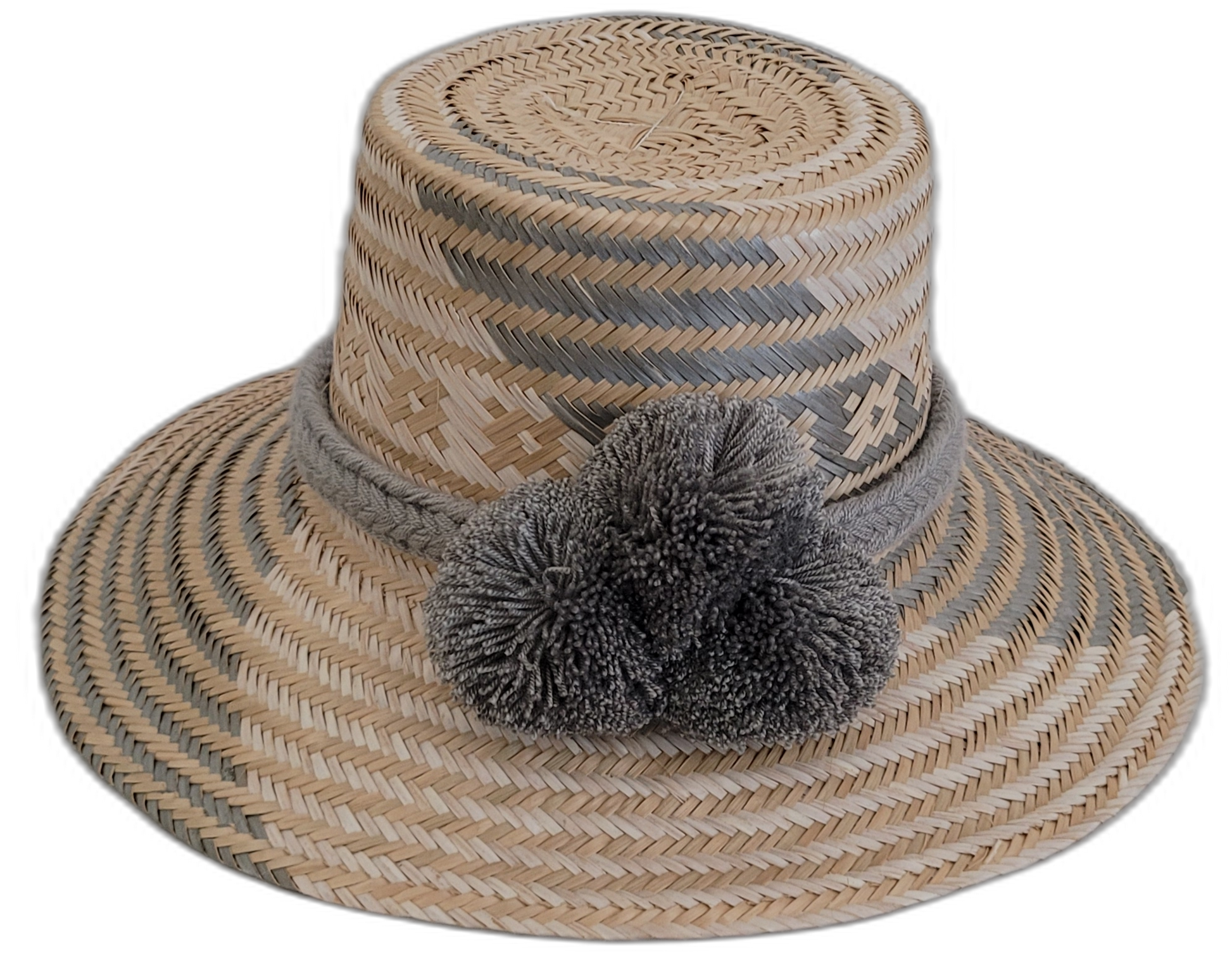 Handmade Wayuu straw hat with natural and gray weave, plus soft gray pompoms.

