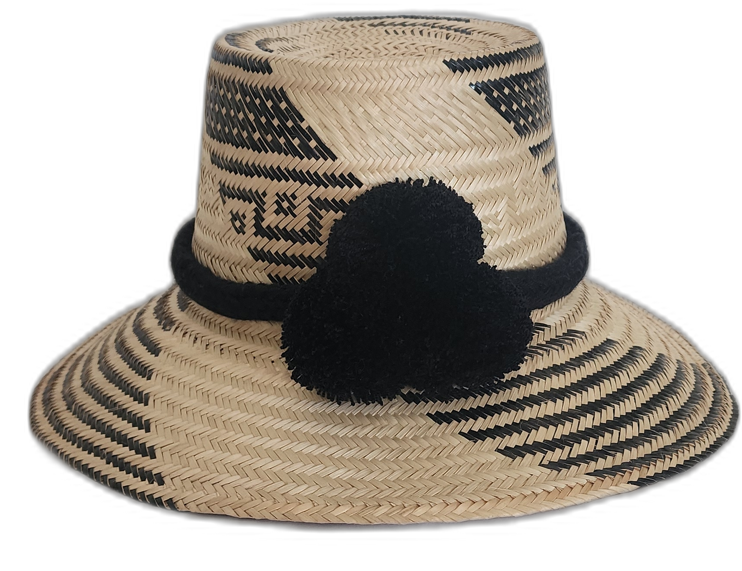 Handmade Wayuu straw hat with black tribal pattern and black pompoms